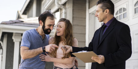 couple-signing-papers-fr-new-house